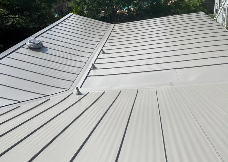 Solar attic fan installed on a metal roof for Roof Ventilation in Cockeysville